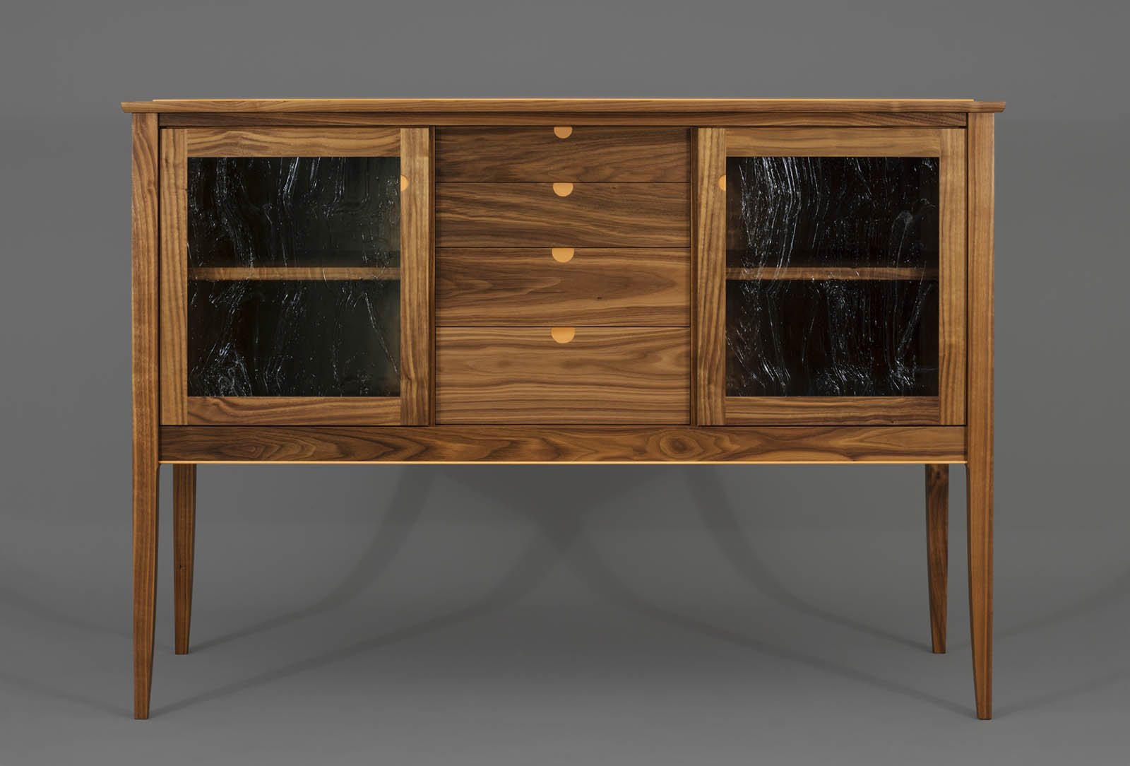 Fine furniture sideboard in claro walnut with pear wood detail by Hugh Montgomery