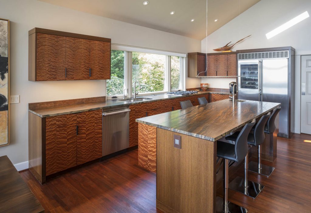 Bubbly and vibrant Quilted Makore and Wenge modern kitchen by Hugh Montgomery