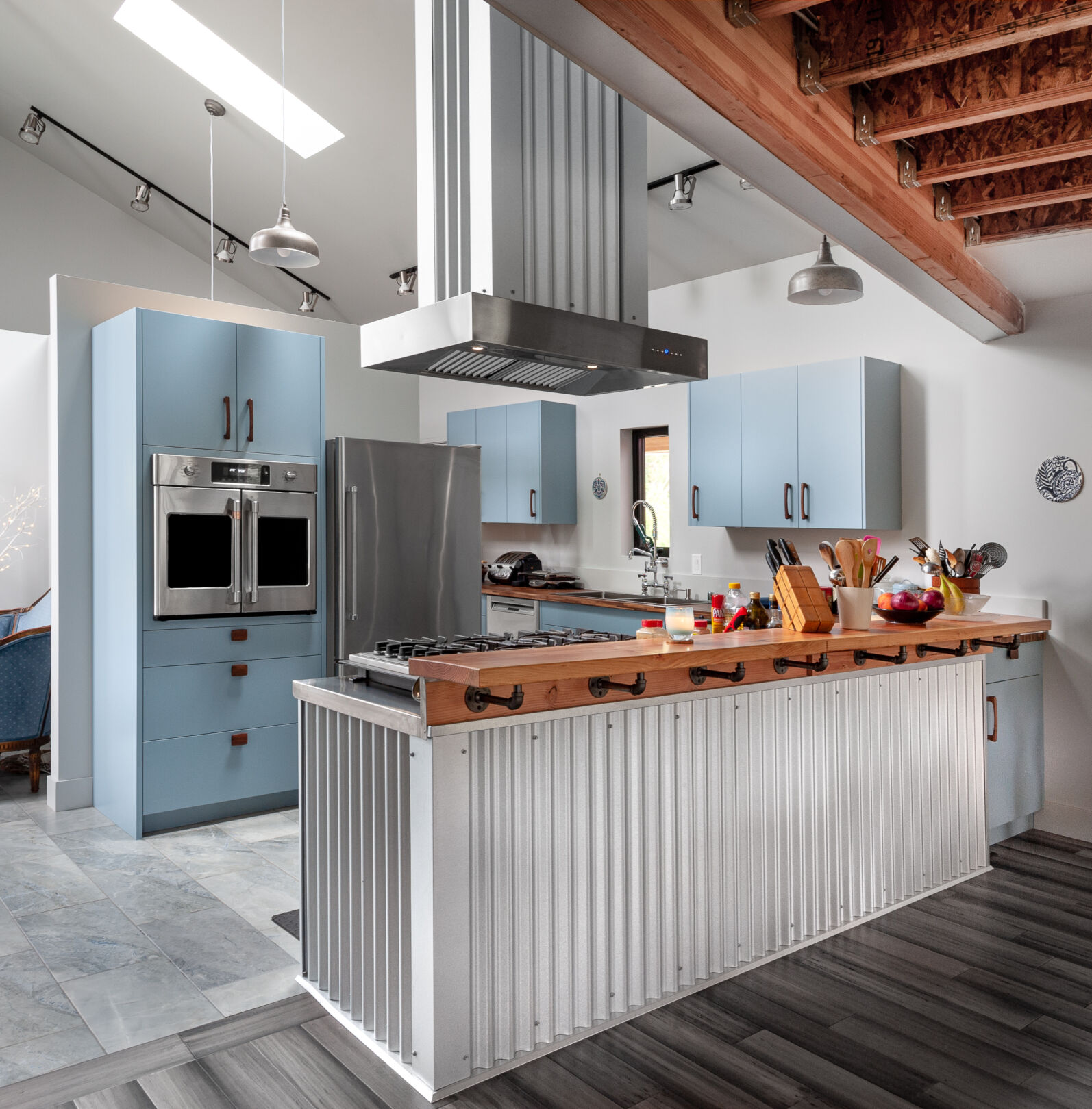Modern, blue-grey painted custom kitchen cabinetry