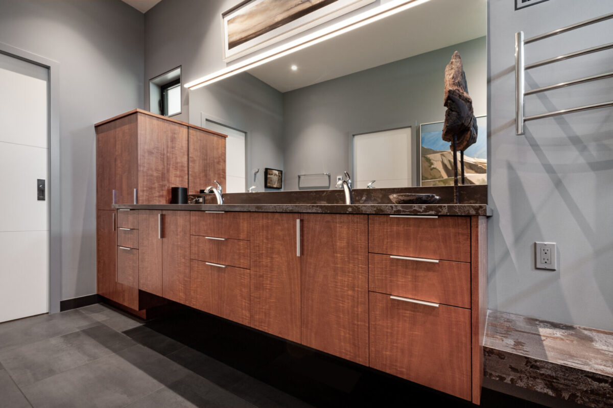 Suspended cabinetry with curly Khaya custom veneers and contemporary lines